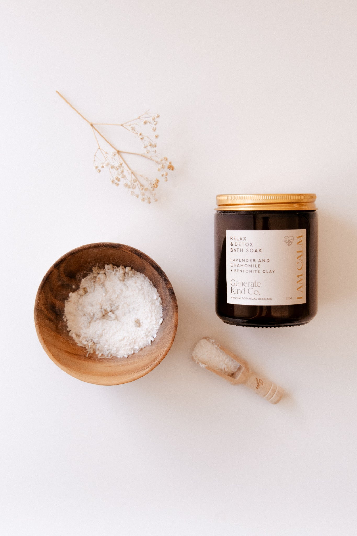 Generate Kind CO. Bath Soak next to wooden bowl of Soak and small wooden spoon