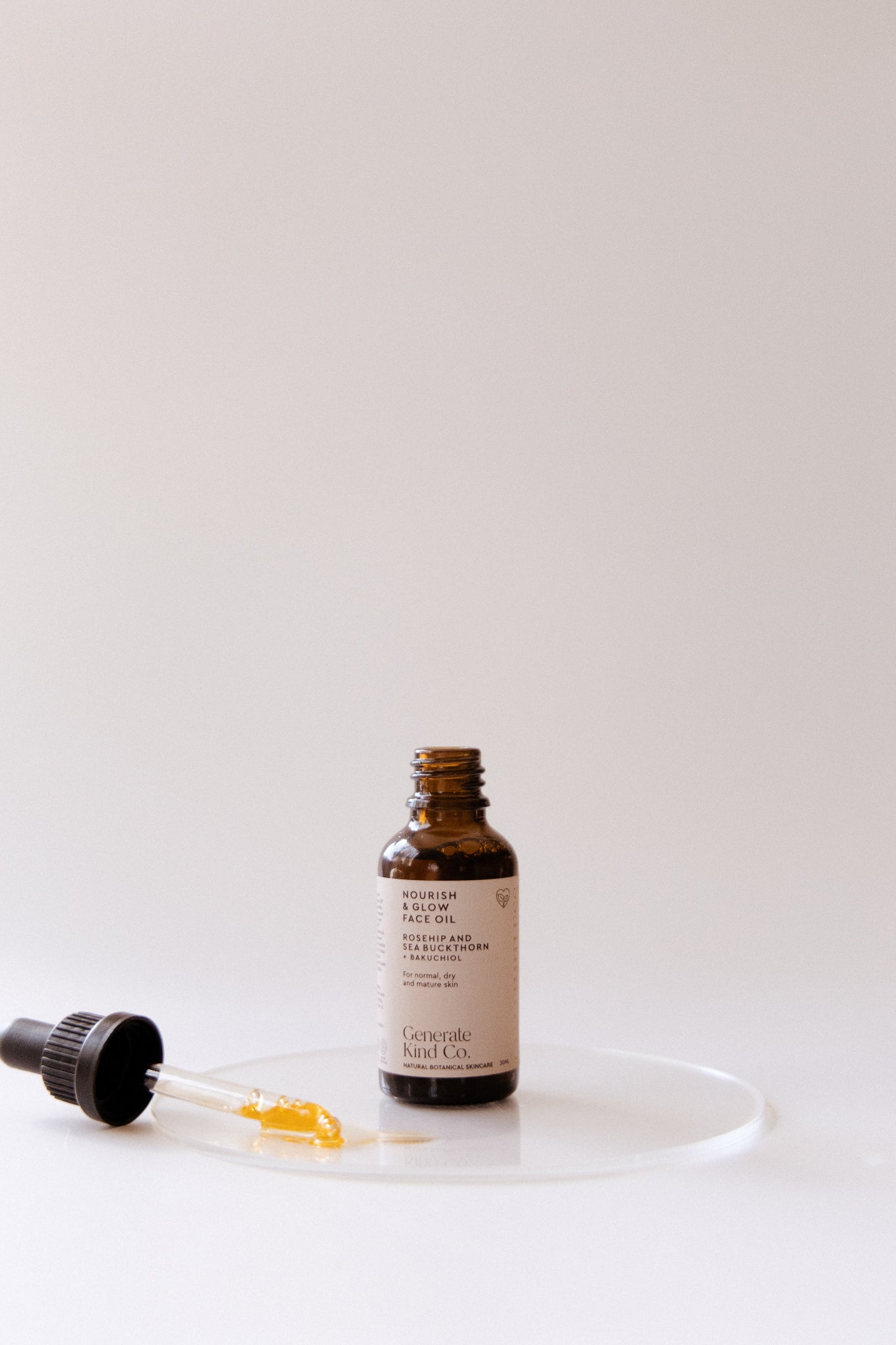 Generate Kind Co. Nourish & Glow Face Oil Skincare bottle with dropper on a white background