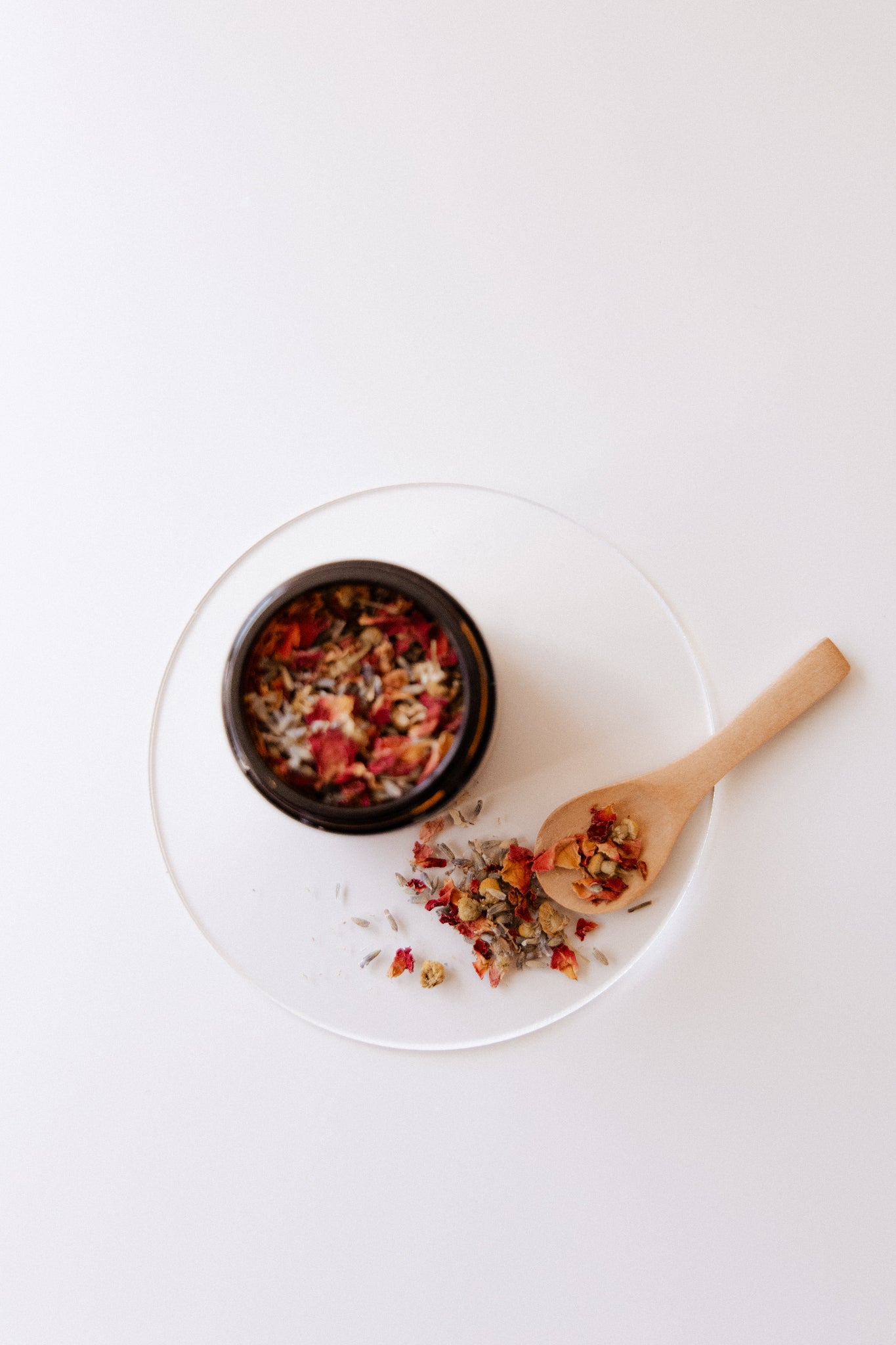 Botancial Face steam on a white plate with a wooden spoon 