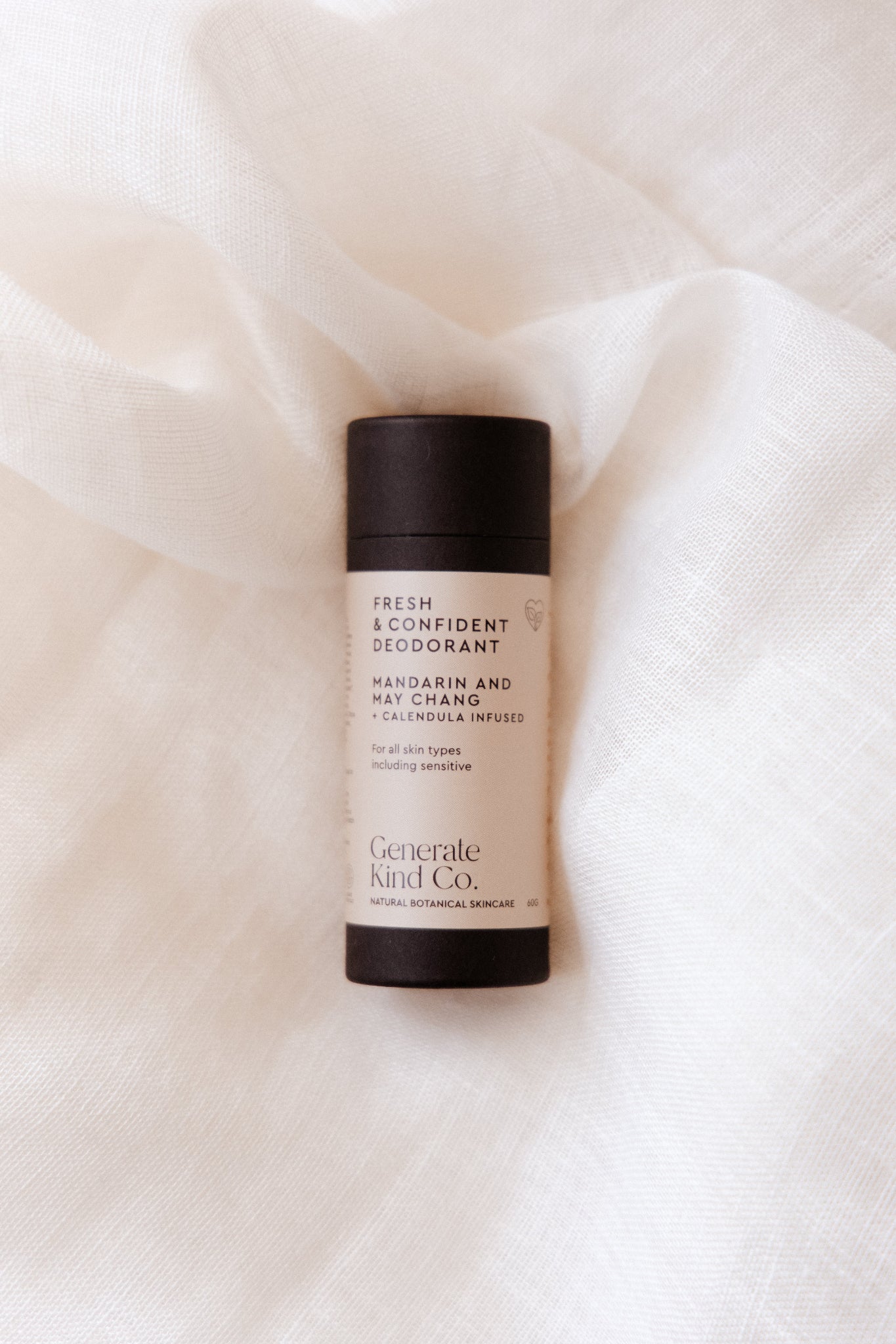 Deodorant in eco friendly tube on a soft beige fabric background